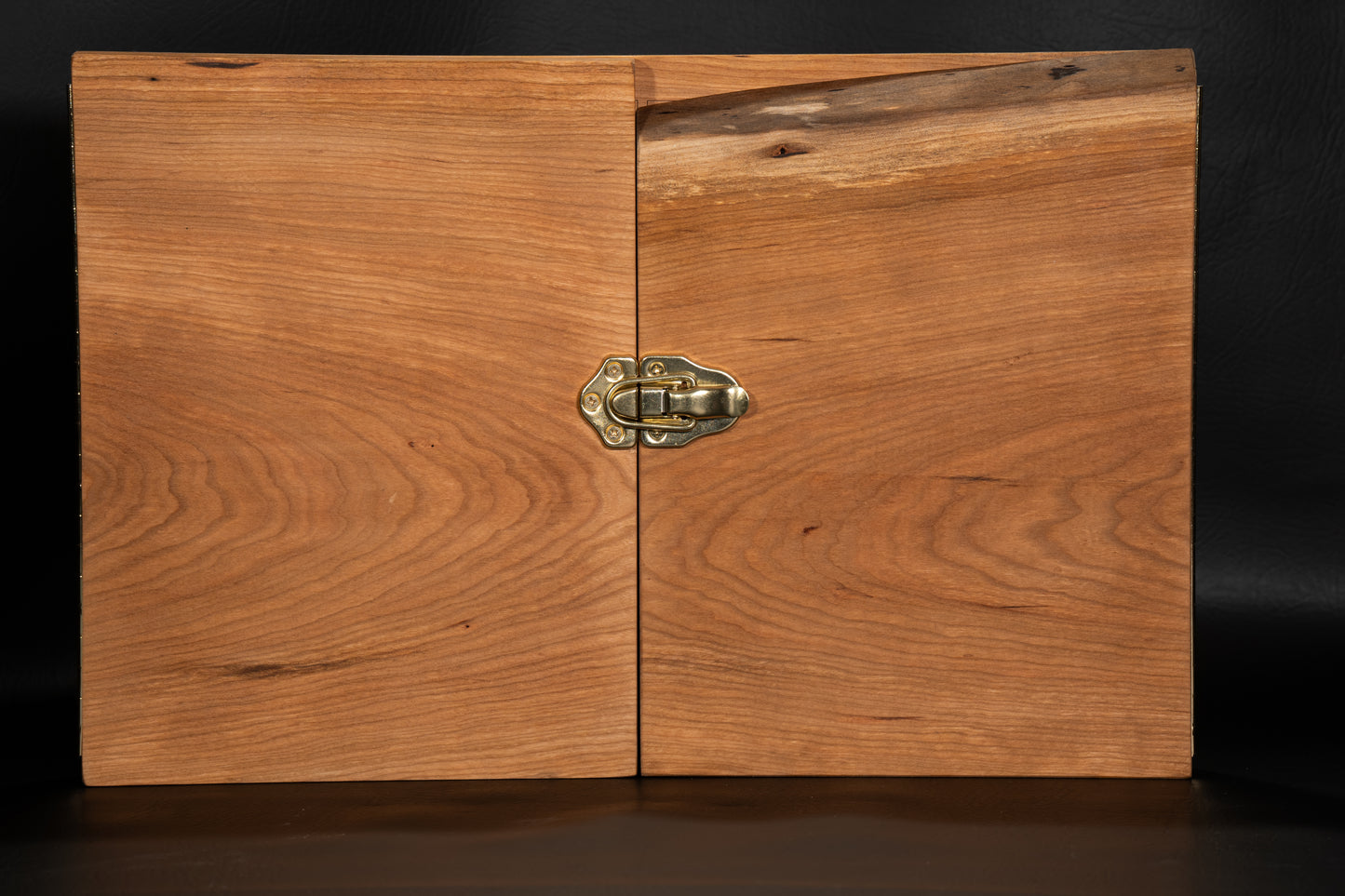 Walnut Wooden Game Master Screen Closed with a golden lock keeping the box closed.