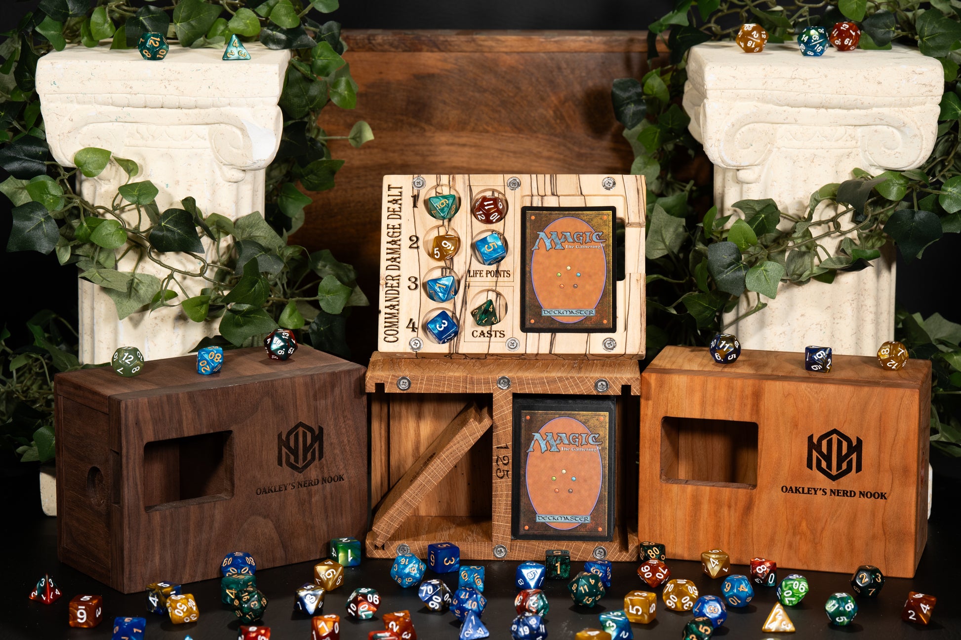 Group photo of several magic the gathering commander deck boxes with dice spread throughout the photo. Additionally, two giant white pillars behind each side of the boxes with plants wrapped around them for aesthetic. Truly a visually pleasing image.