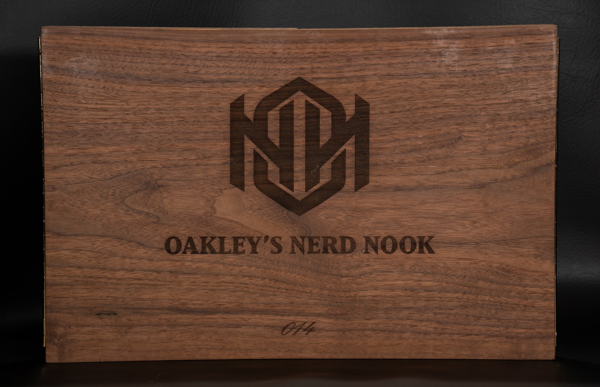 Walnut Wooden Game Master Screen Front with text imprinted "Oakley's Nerd Nook".