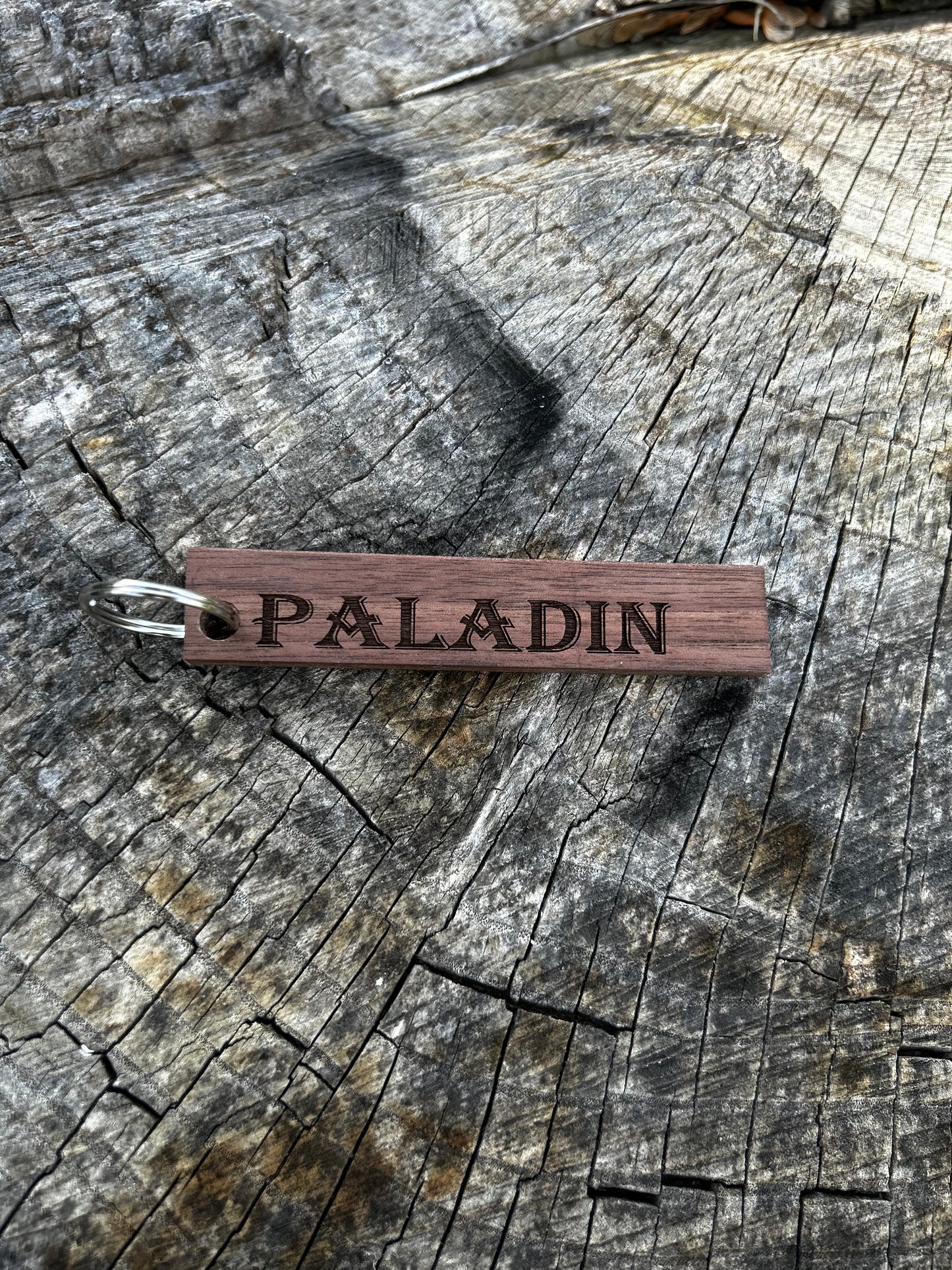 Willow Wooden Keychain with the word "Paladin" and the Oakley Nerd Nook logo pressed into it