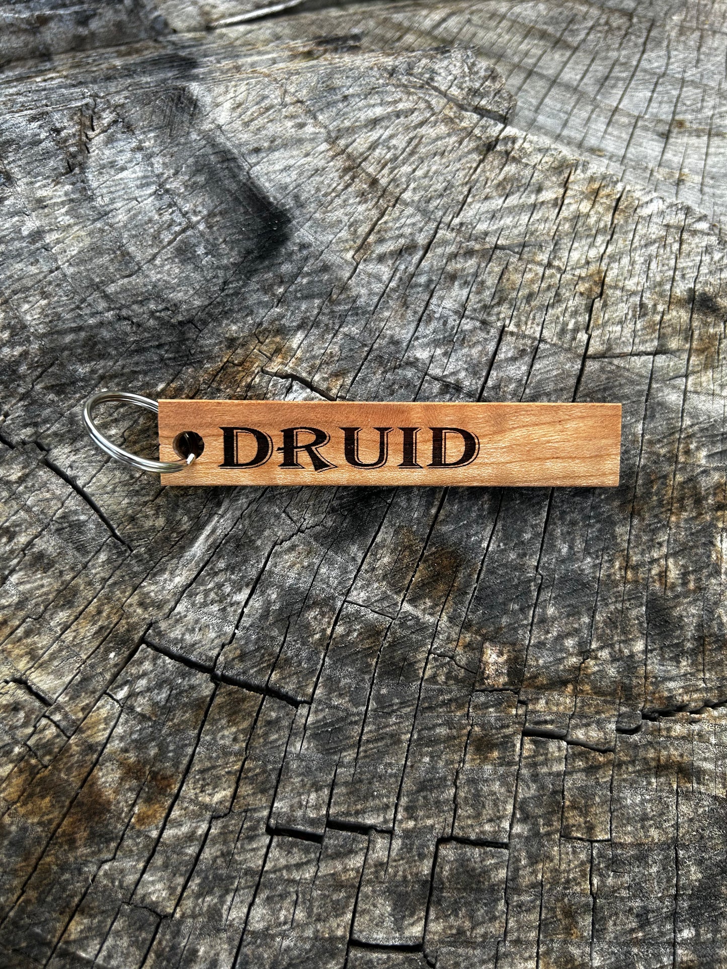 Oak Wooden Keychain with the word "Druid" and the Oakley Nerd Nook logo pressed into it