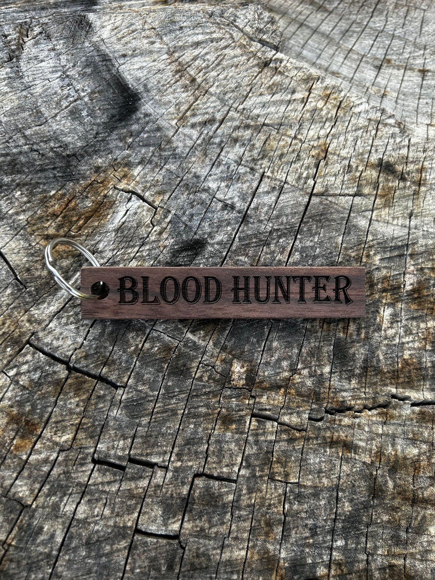 Willow Wooden Keychain with the word "Blood Hunter" and the Oakley Nerd Nook logo pressed into it