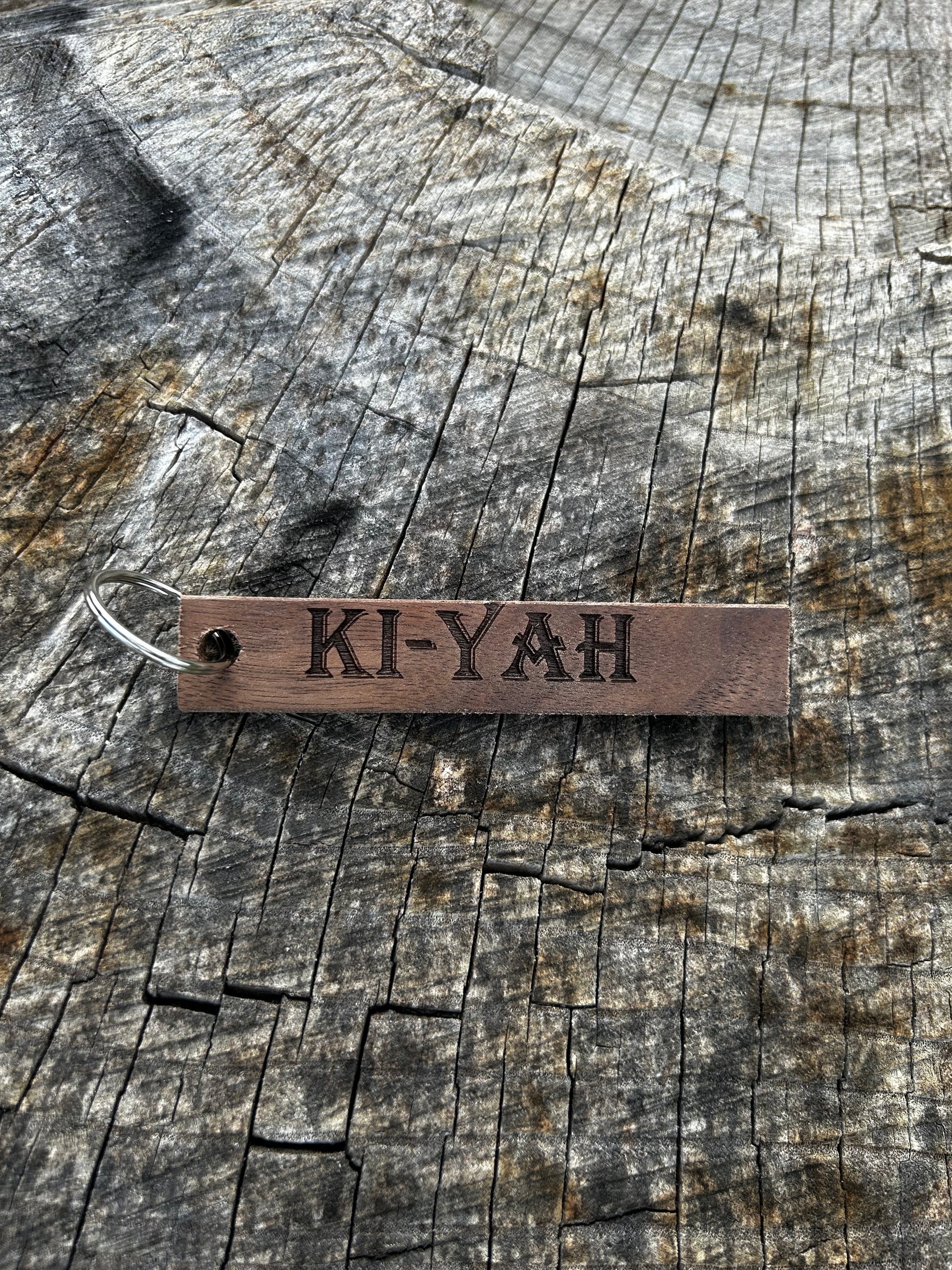 Willow Wooden Keychain with the word "Ki-Yah" and the Oakley Nerd Nook logo pressed into it