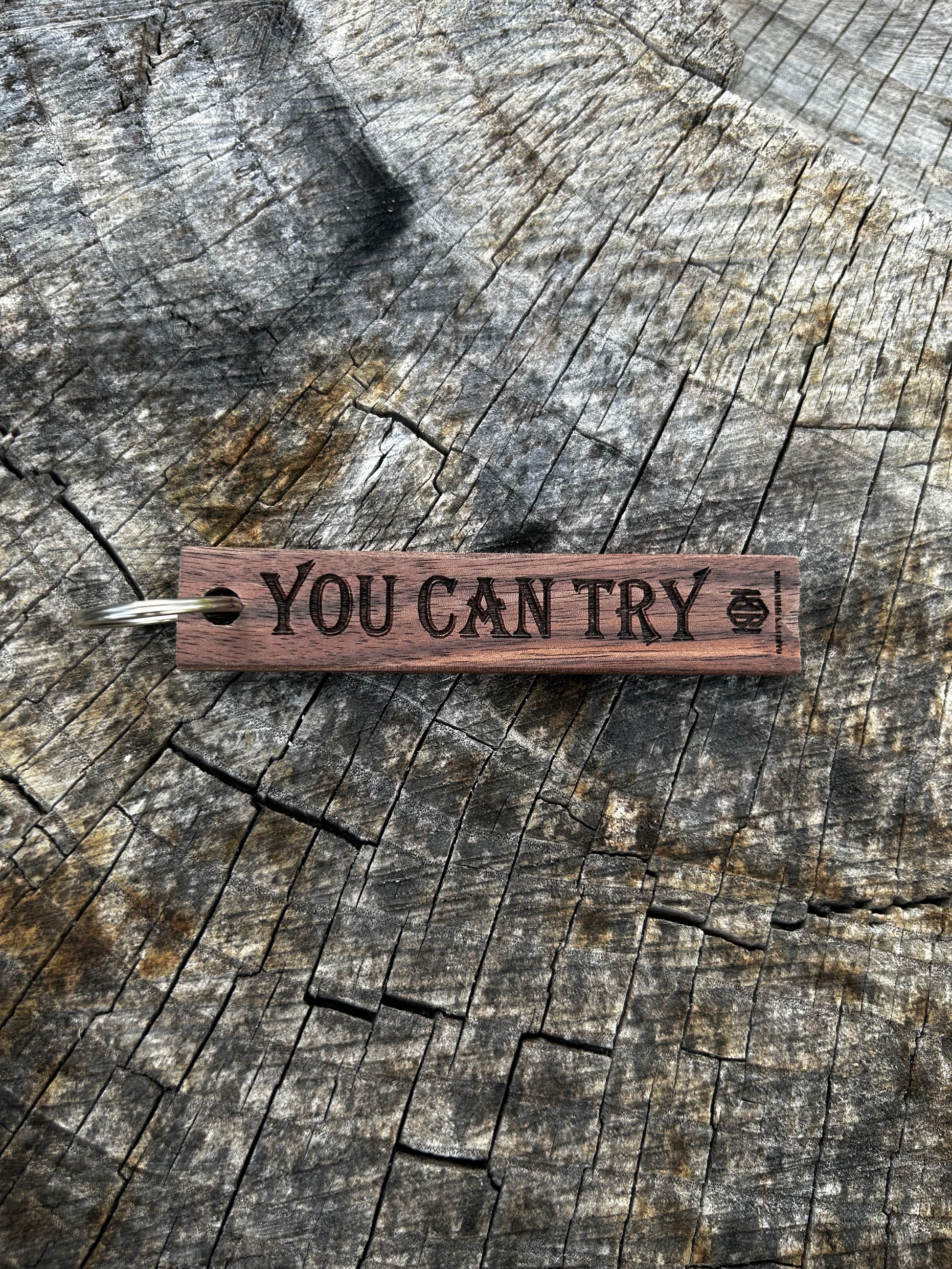 Willow Wooden Keychain with the word "You Can Try" and the Oakley Nerd Nook logo pressed into it